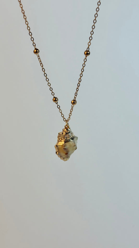 Necklace with a small pendant on a light gray background