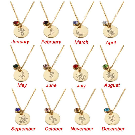 Gold necklaces with circular pendants for each month of the year on a white background.
