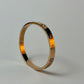 Gold bracelet with embedded zircon stones