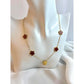 Necklace with flower-shaped pendants on a mannequin bust.