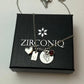 Necklace with charms on a Zirconiq branded box